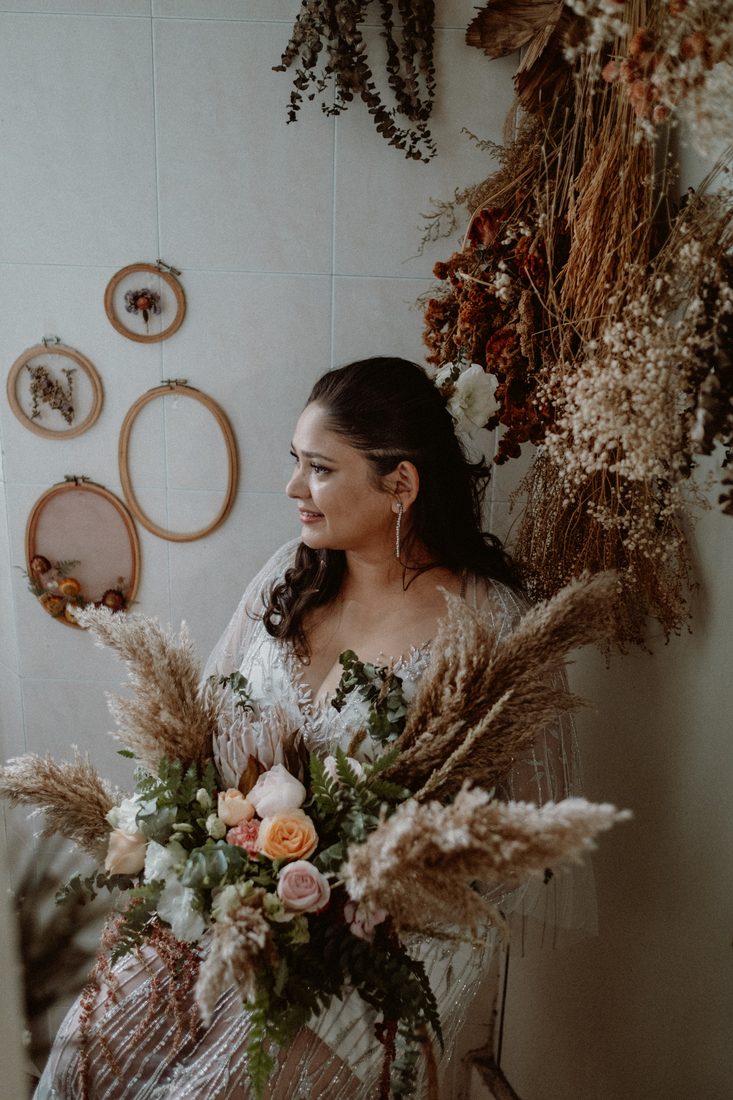 Ceremony arch in blush roses and greenery