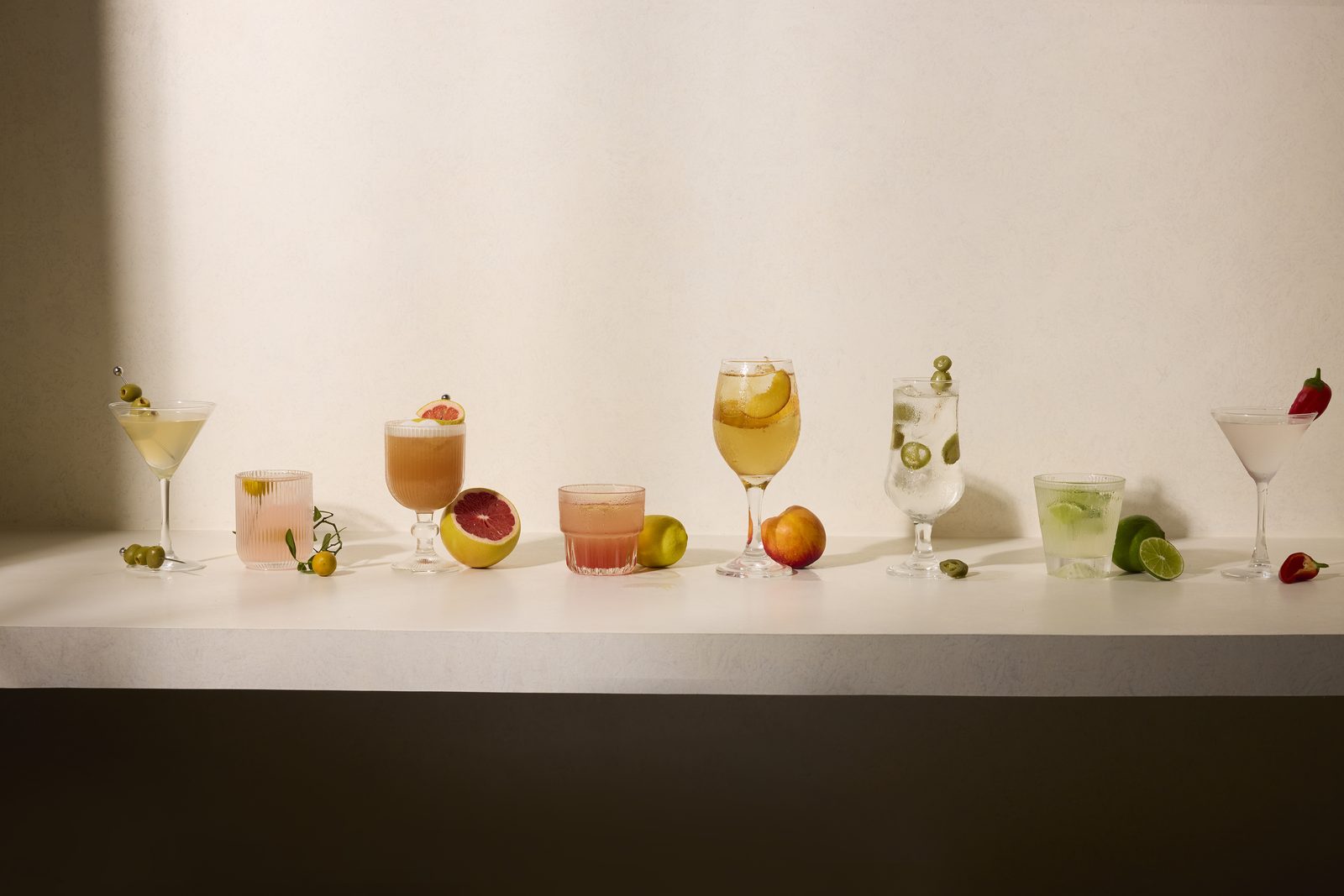 Styled glassware and fruit on a shelf