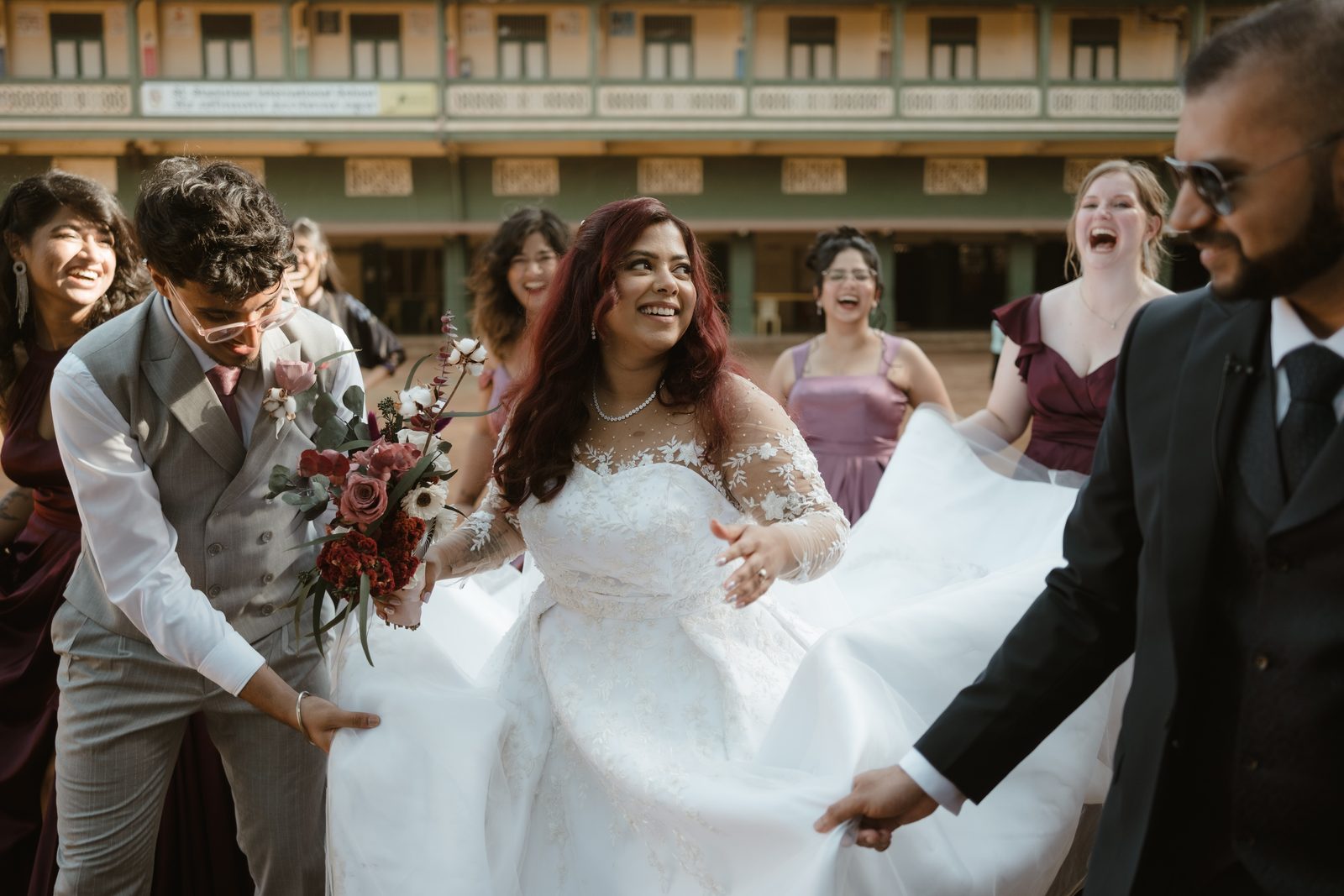 Bride with her bouquet among the wedding party