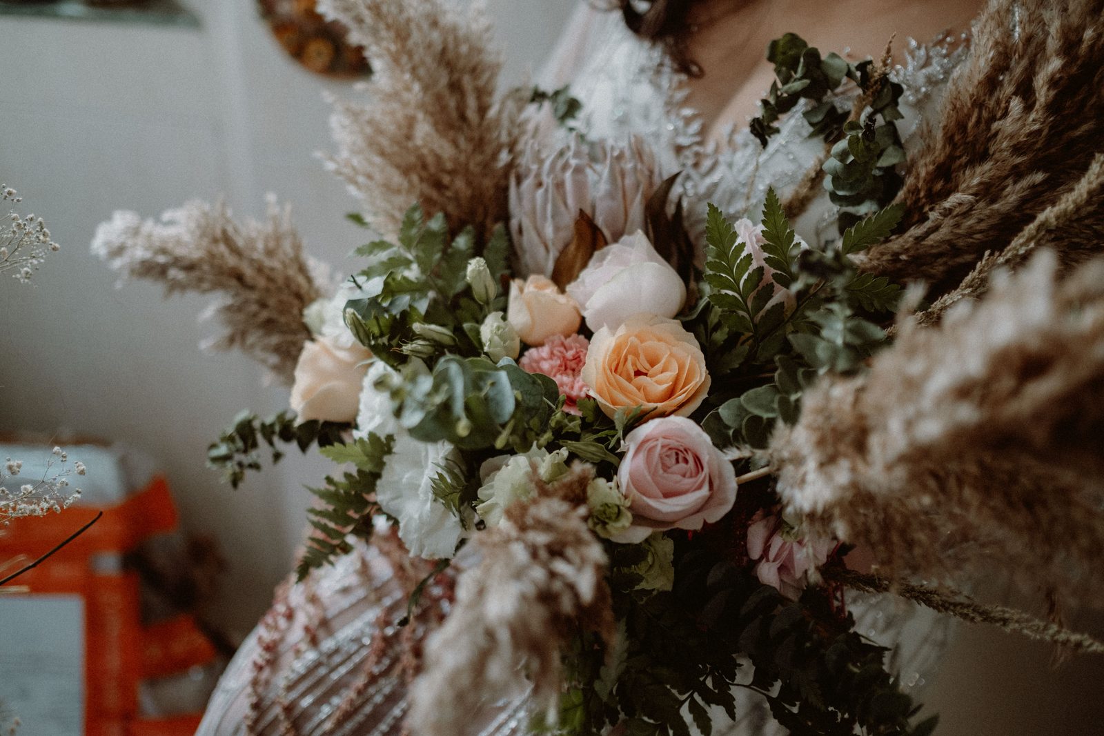 Couple with bridal florals