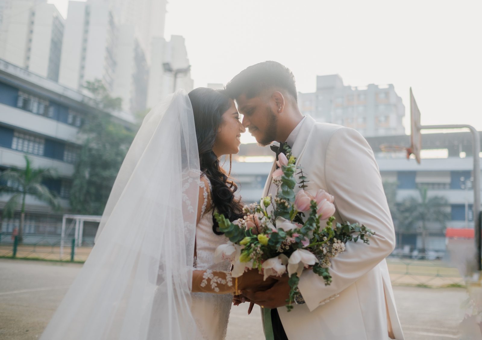 Couple together with the bridal bouquet
